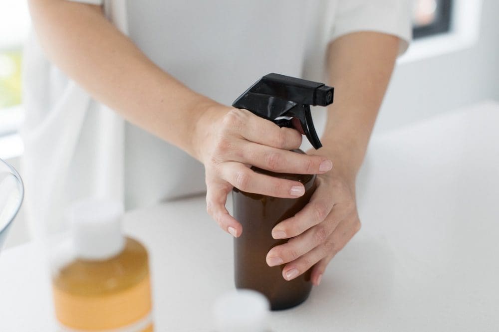 DIY natural cleaning spray in reusable bottle