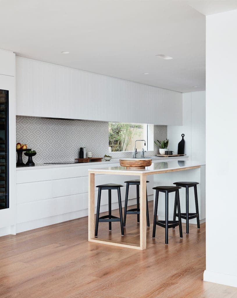 Island bench in white kitchen styled by Oliver Myles