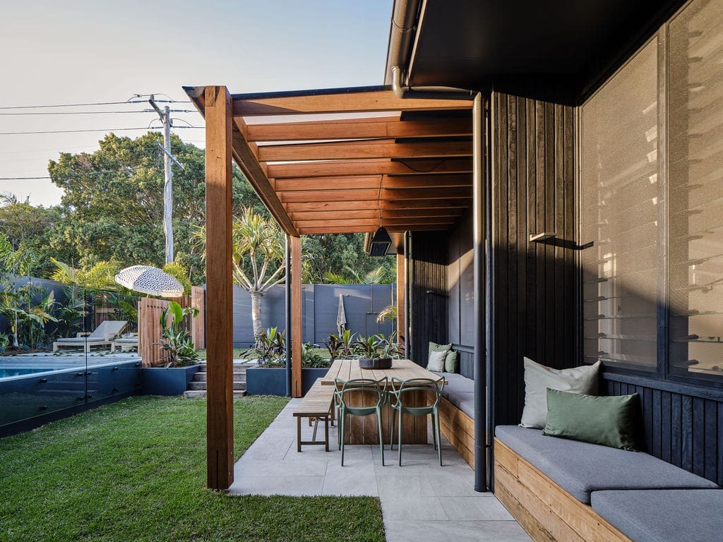 Outdoor living overlooking pool Barefoot Villa