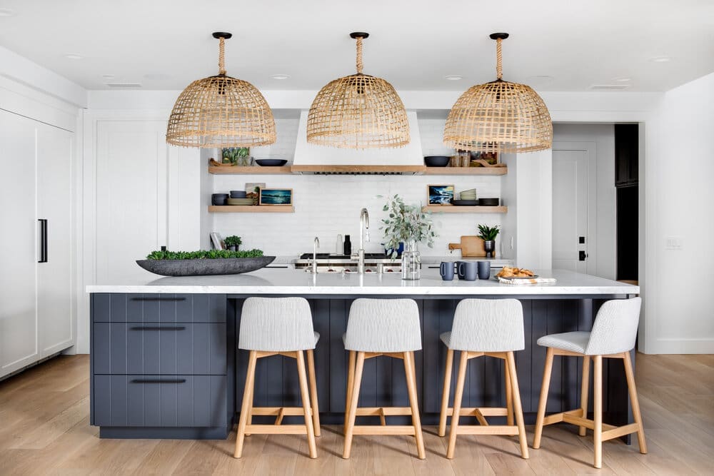 small white boho kitchen with brick wall