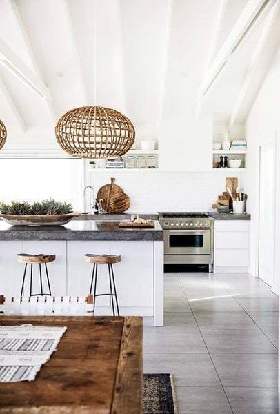 White kitchen with wood accents and basket pendant