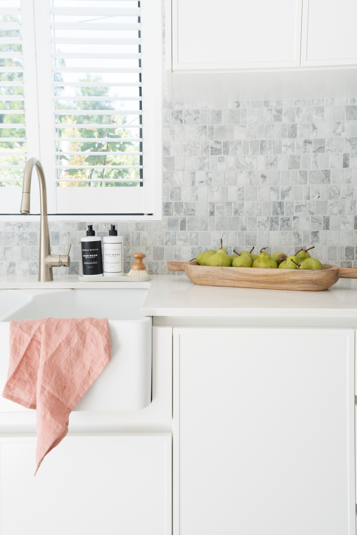 Tea towel draped over kitchen sink is one of the great ways to style your kitchen