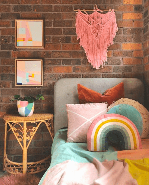 The Colour Tribe_80s home_bedroom with rainbow cushion