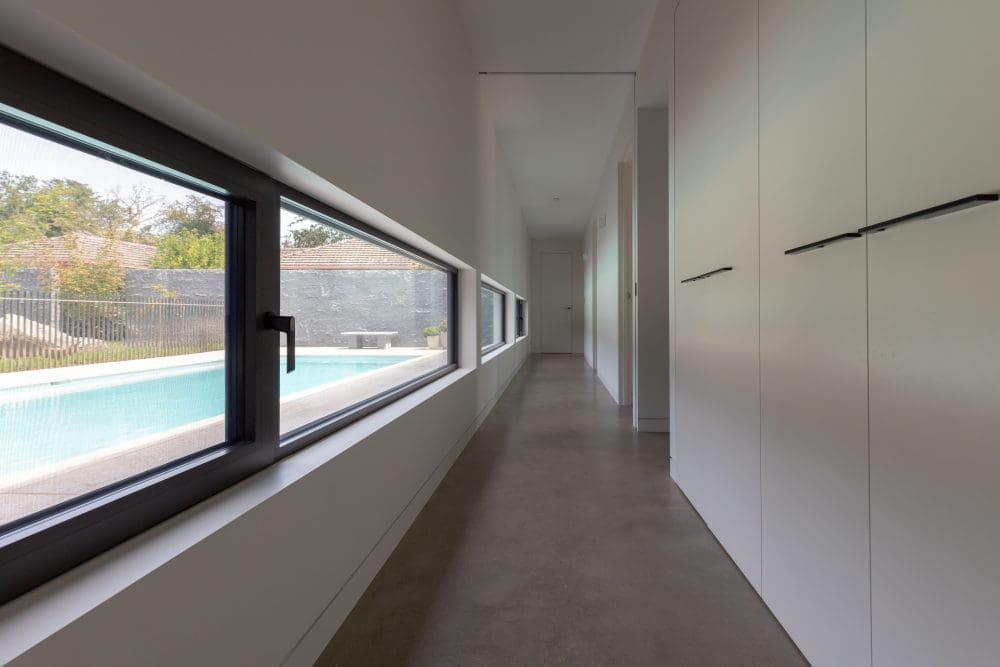 Low windows in hallway of Concrete House