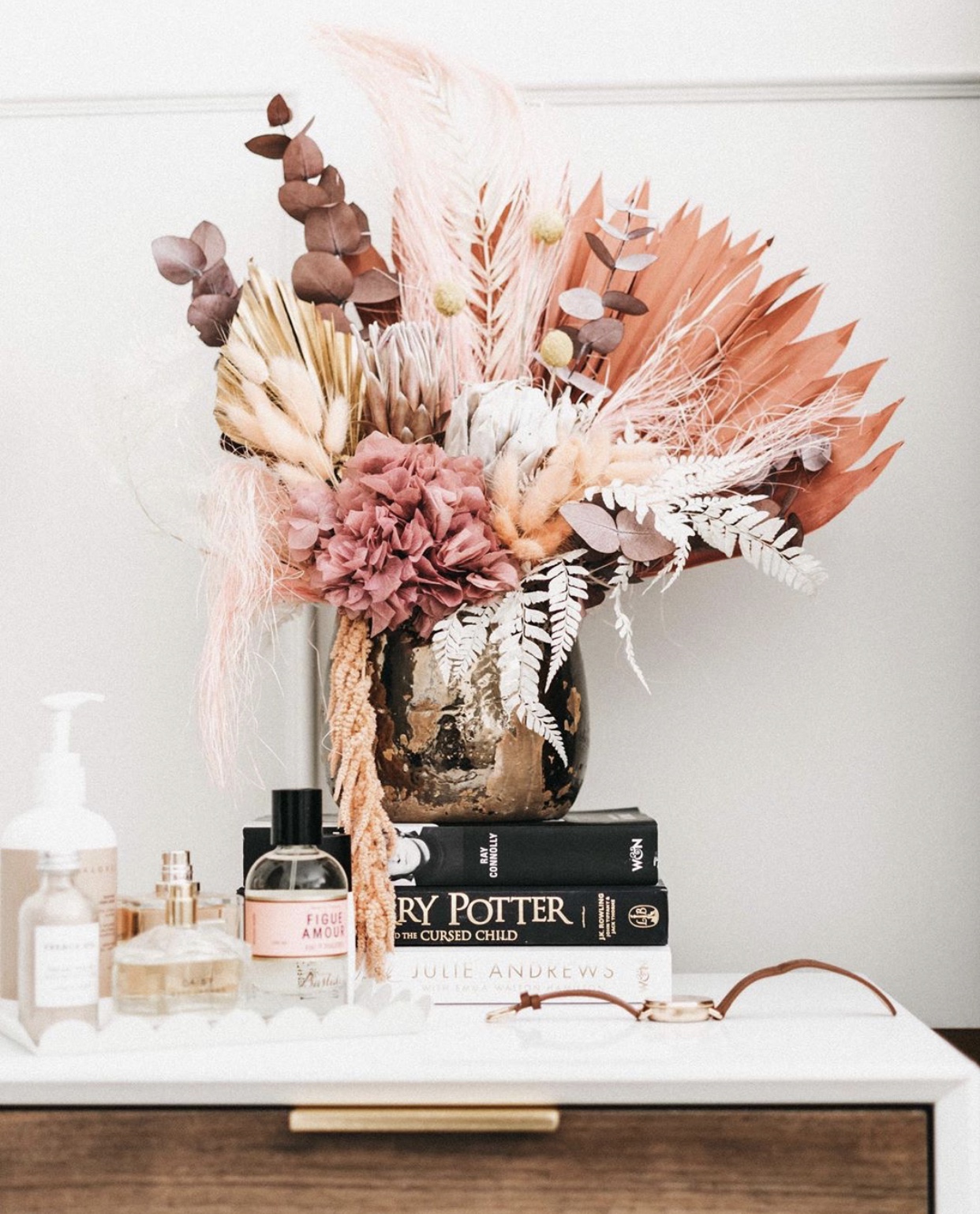 Dried floral arrangment on bedside table