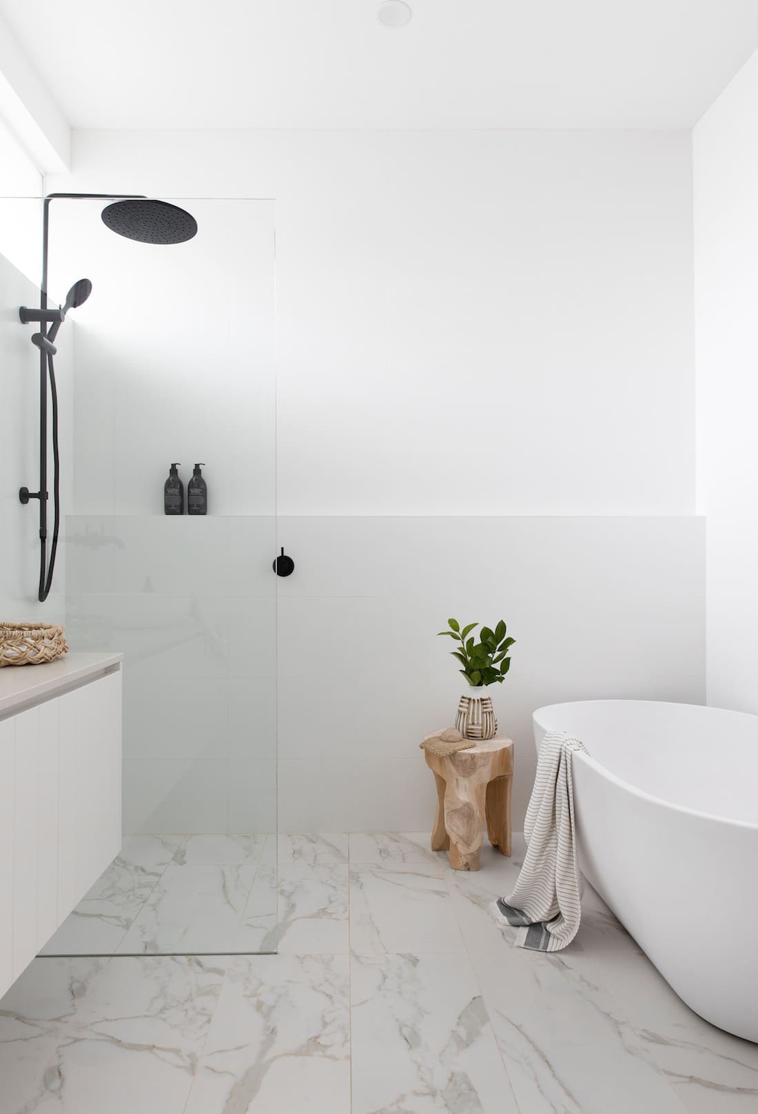 White and grey bathroom with freestanding bath