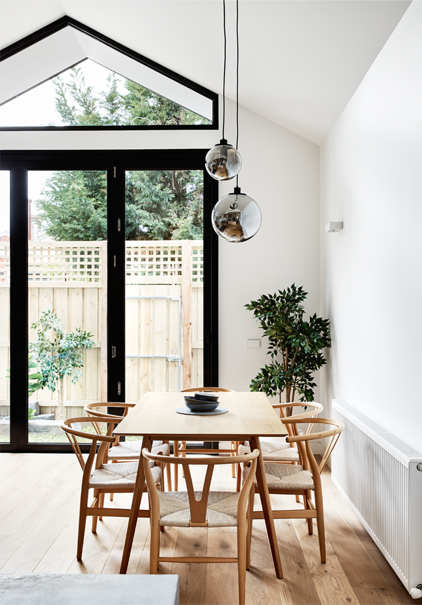 Dot's House_Atlas Architects_dining room_ cathedral ceiling in modest extension