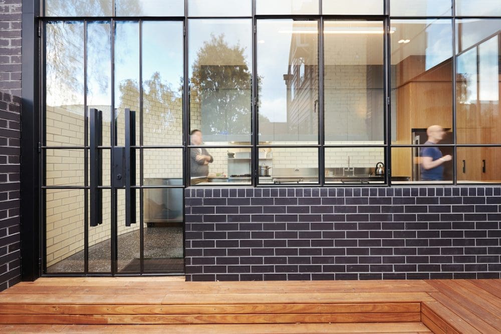 Turn House_Rebecca Naughtin Architect_glass and brick wall