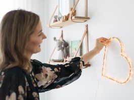 Placing DIY heart wall light in room