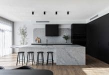 Black kitchen with integrated appliances
