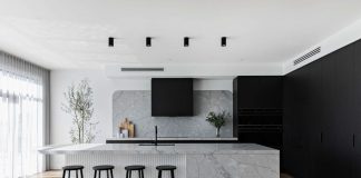 Black kitchen with integrated appliances