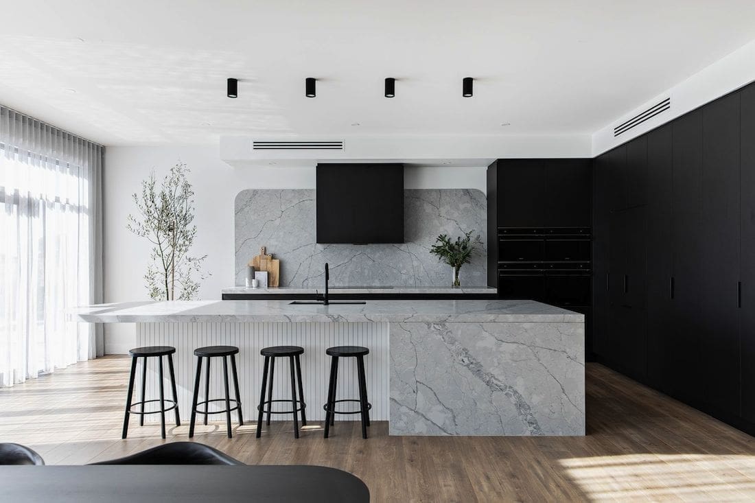 Black kitchen with integrated appliances