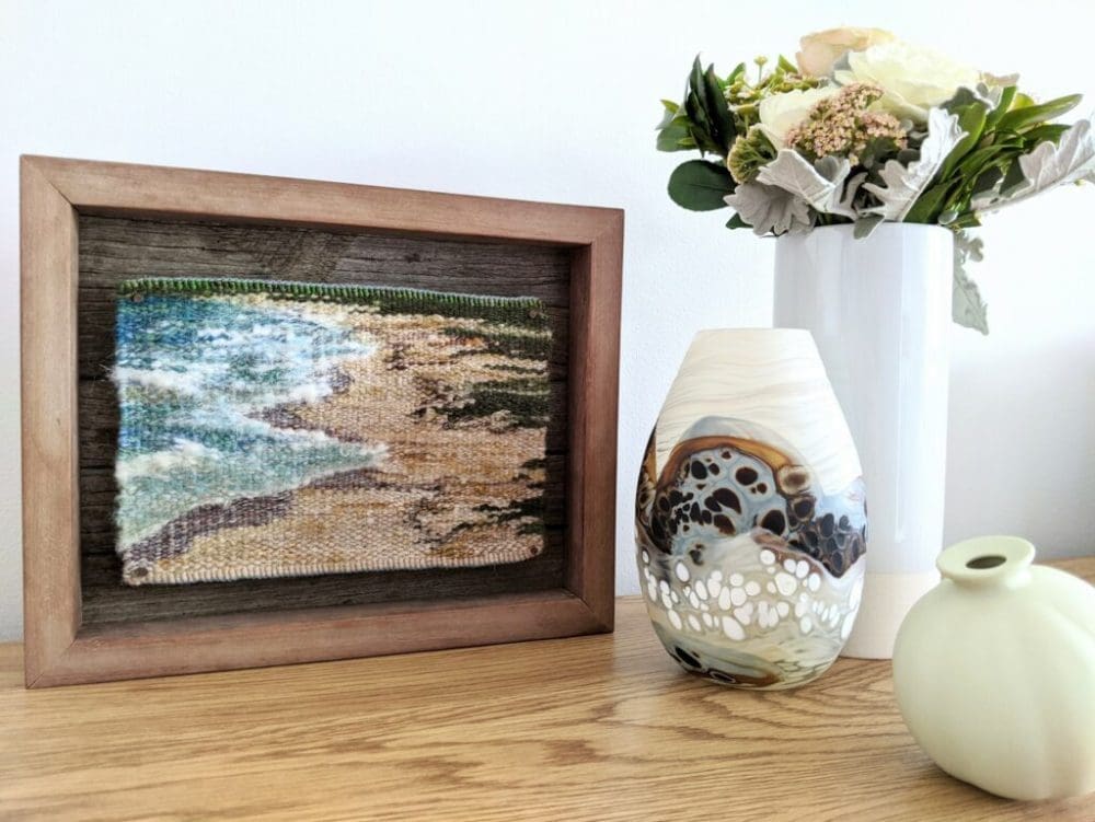 Ocean tapestry art piece in timber frame