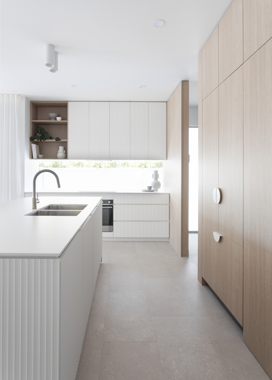 Length of modern timber and white kitchen