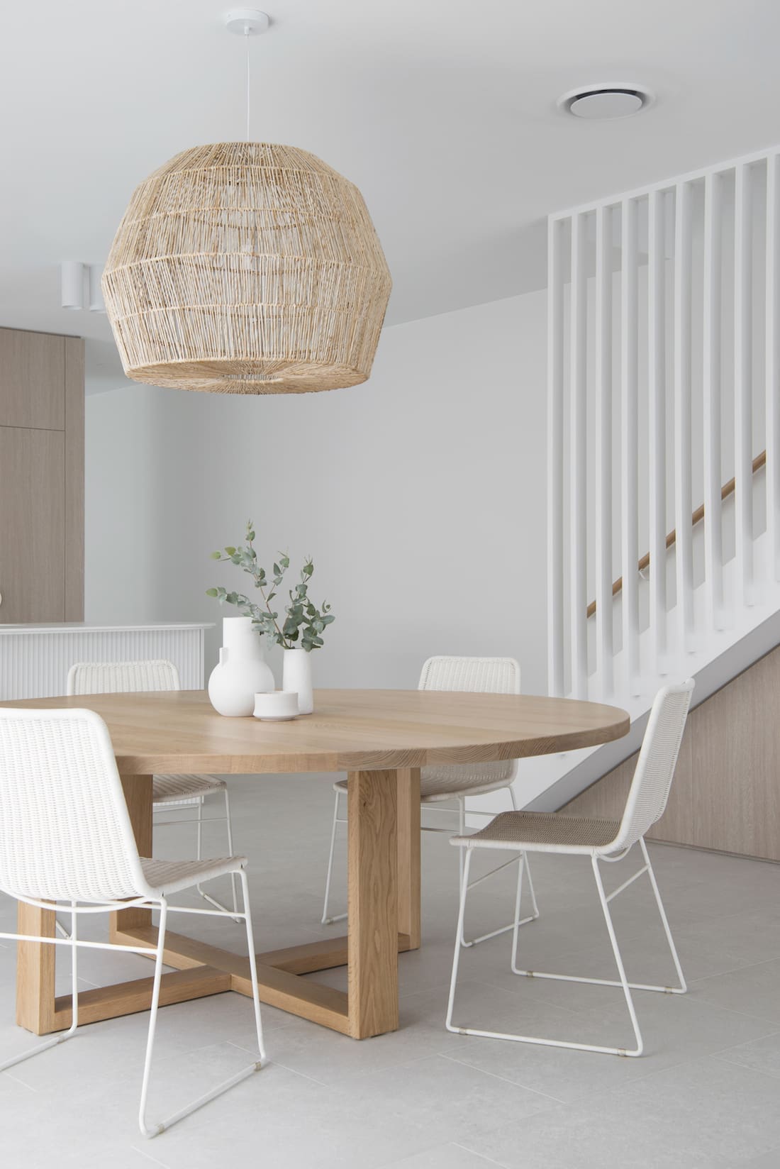 Round dining table with basket pendant