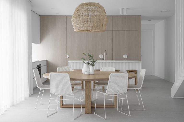 Basket pendant light over round dining table