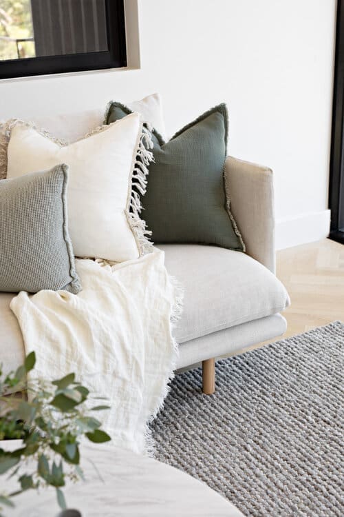 Couch with cushions and throw