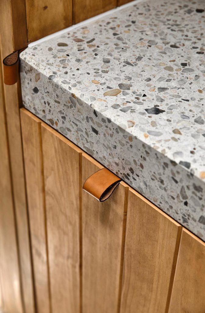 Wood panelled doors with terrazzo counters
