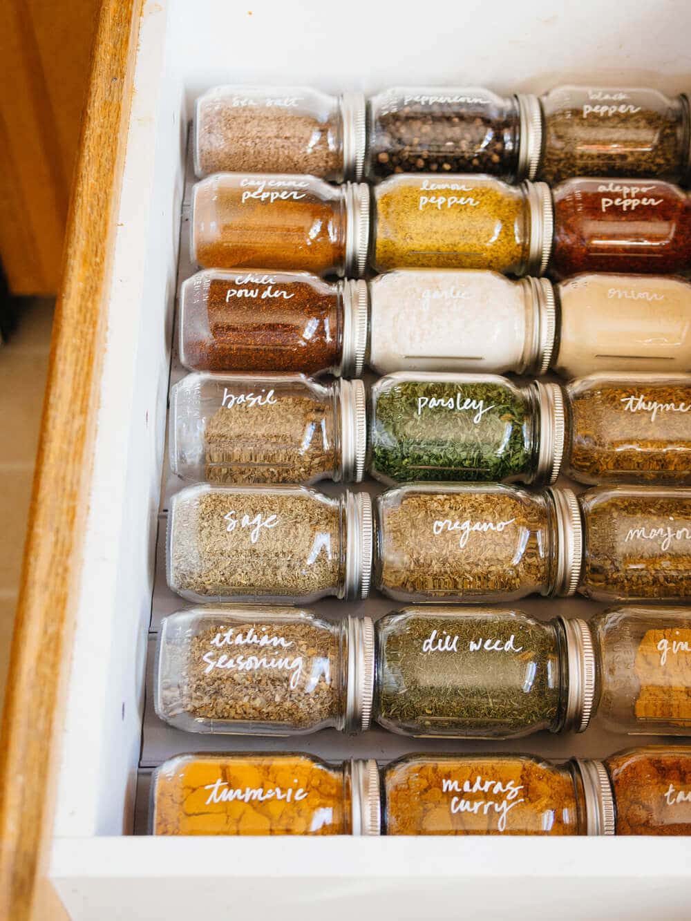 Spice drawer using grooves