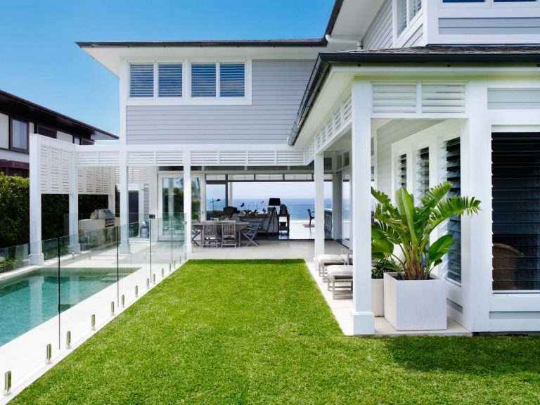 Coastal Australian Hamptons home facade with pool