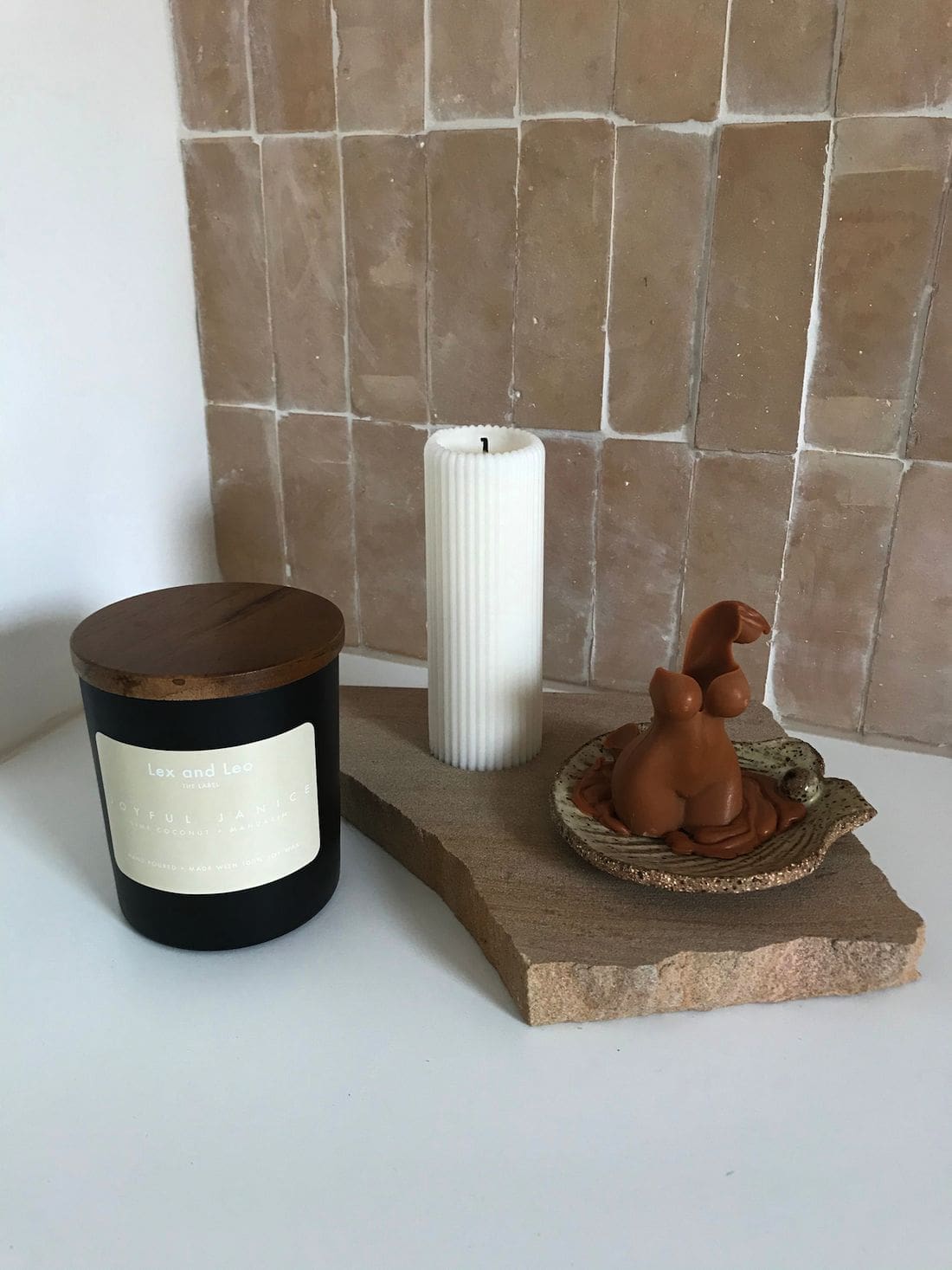 Laundry vignette with pink tile