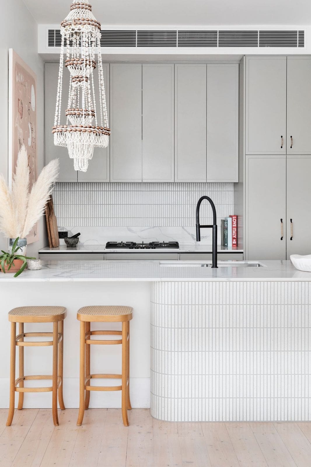 White kitchen with tiled curved bench