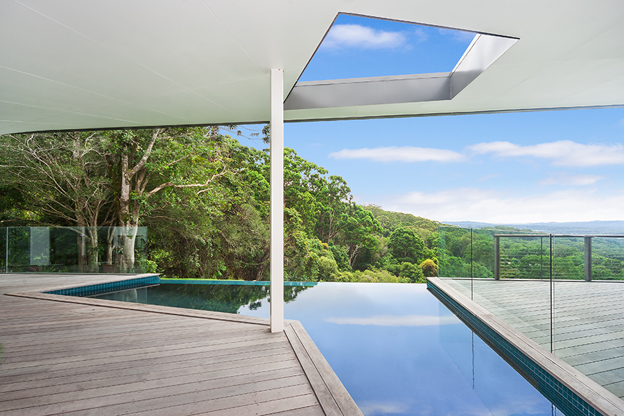 Infinity edge pool with view of forest