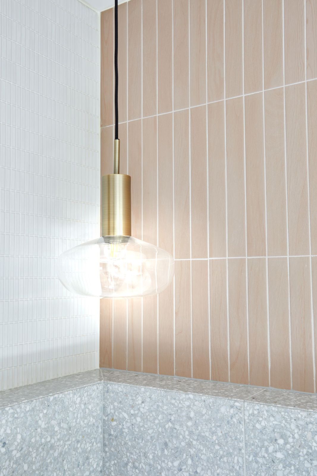 Pink tiles with gold pendant