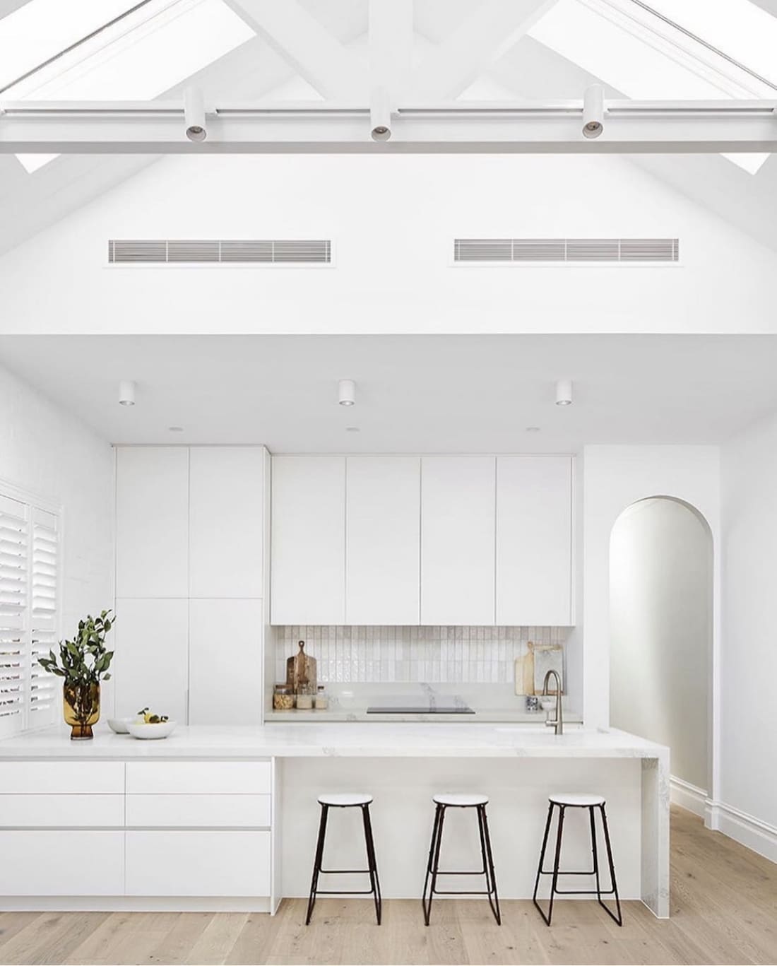 All white kitchen with combination splashback