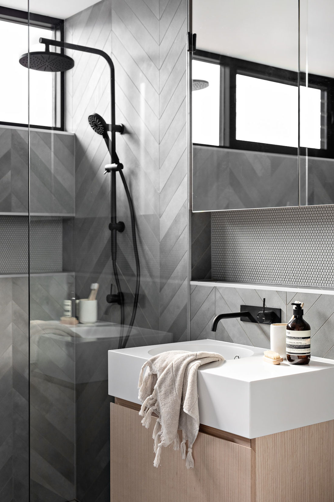 Grey herringbone patterned bathroom