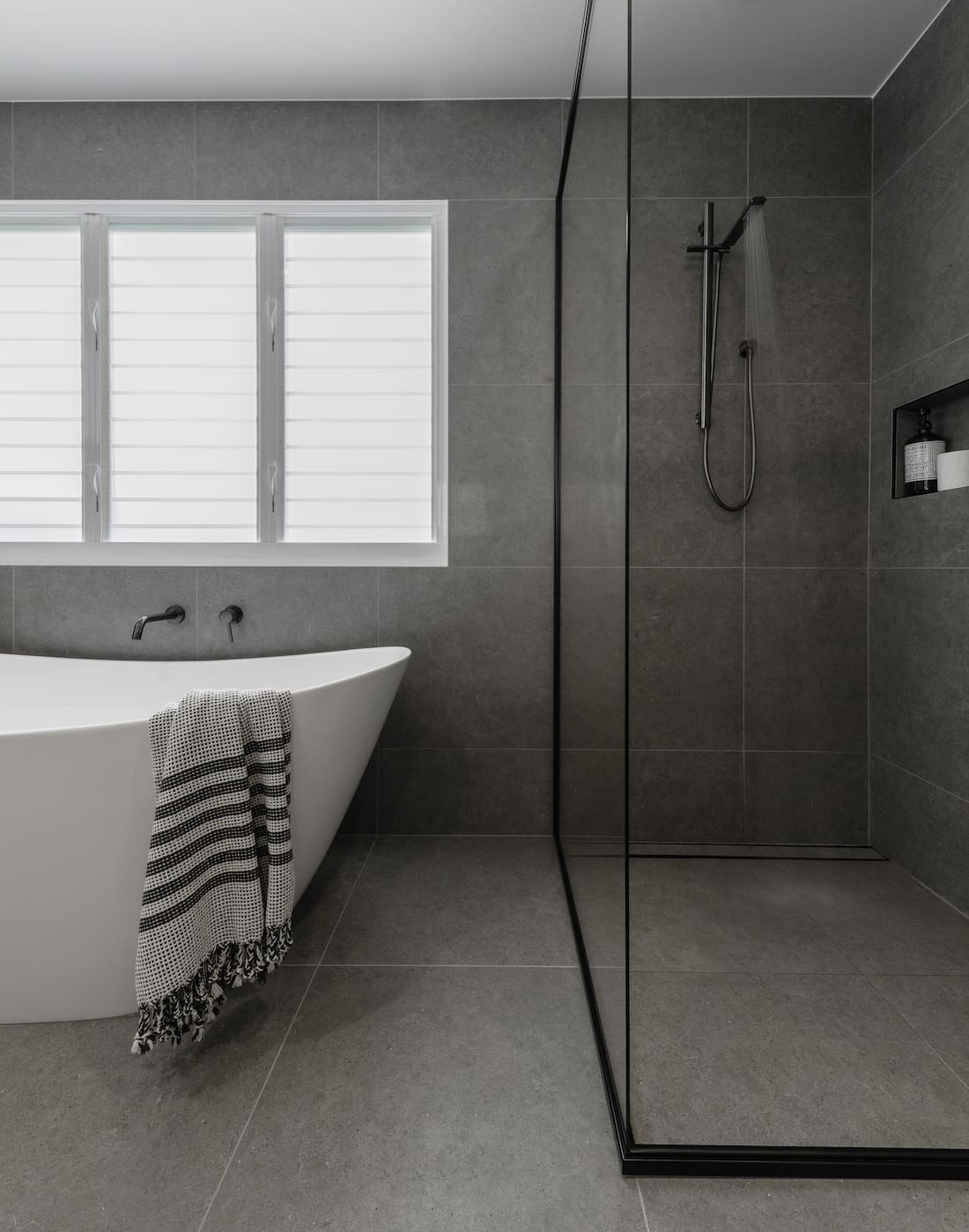 Grey bathroom with freestanding bath