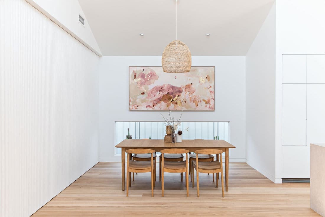 Dining room with art and low level window