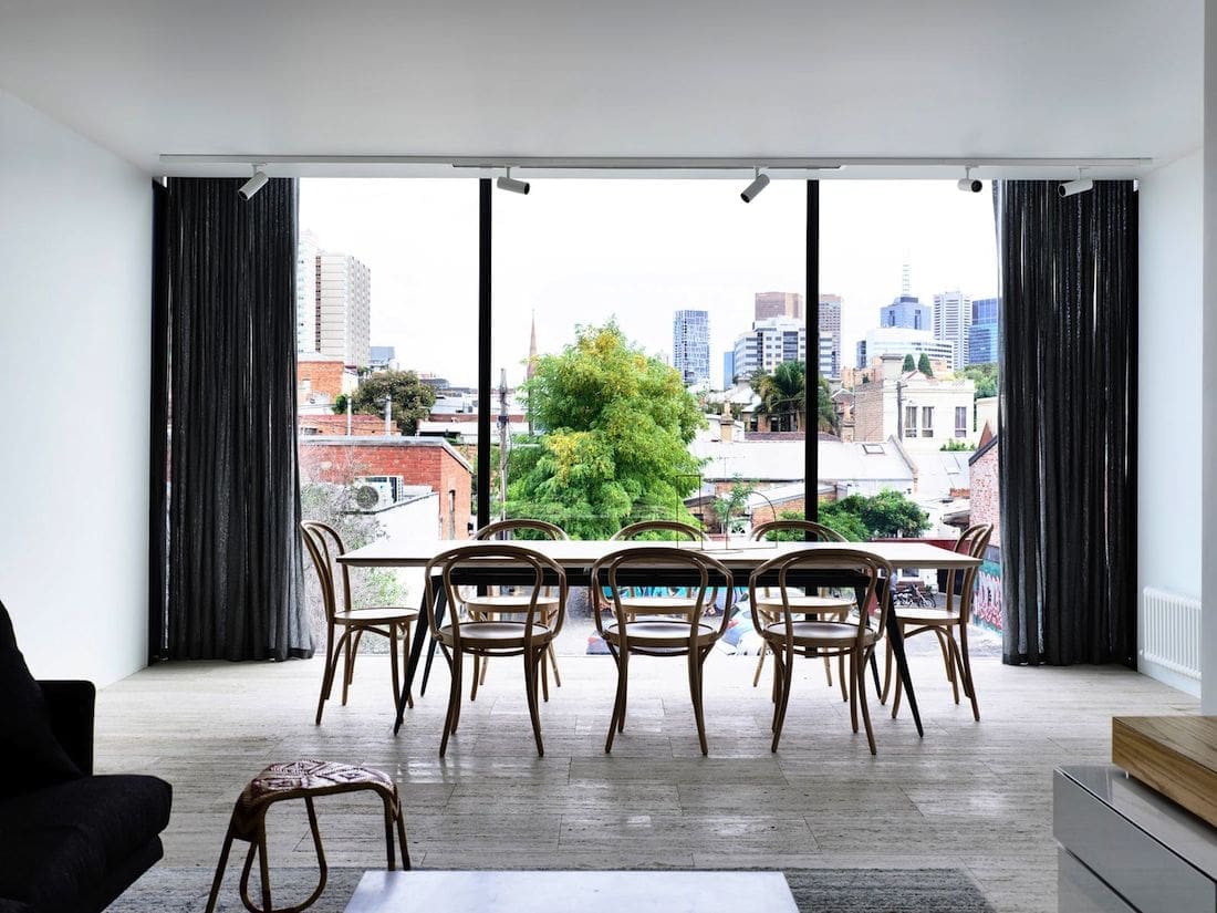 Industrial feel dining room with city view