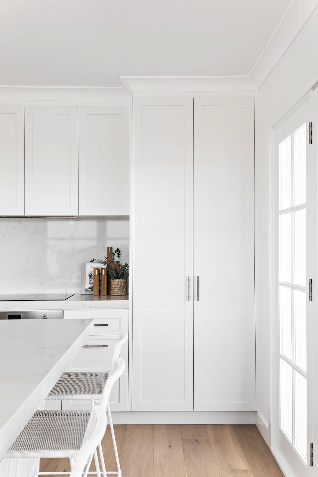 All white kitchen with timber flooring
