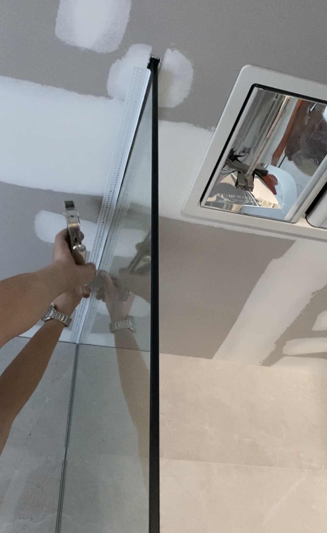 Tear away bead glass floor to ceiling shower screen