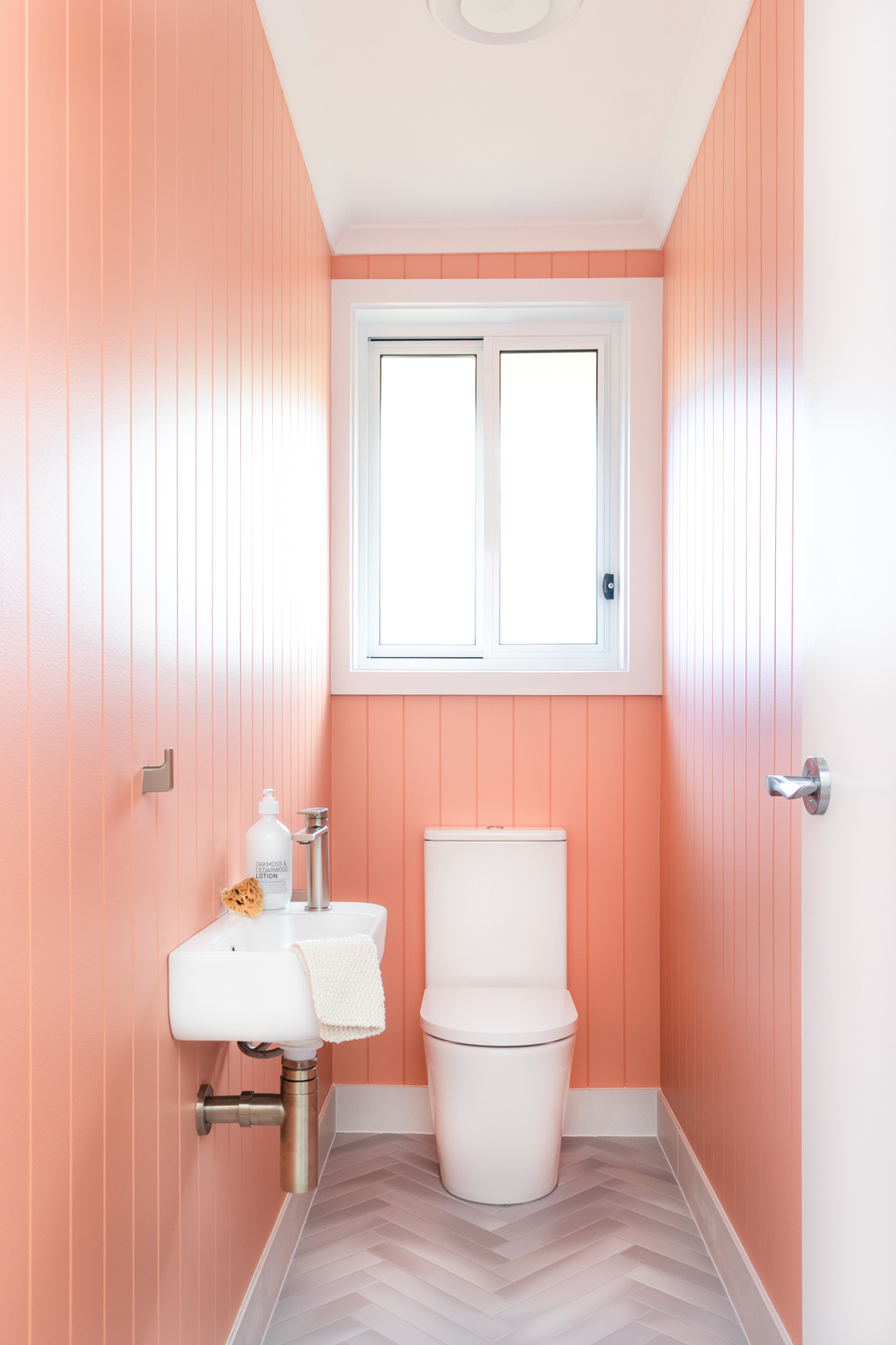 Pink panelled bathroom walls