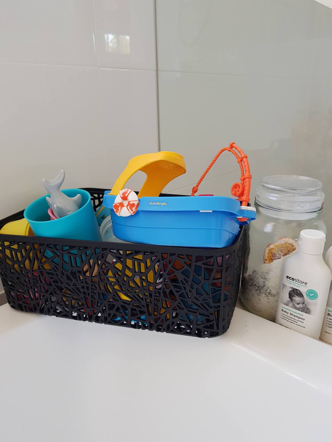 Bath toys stored in Kmart basket