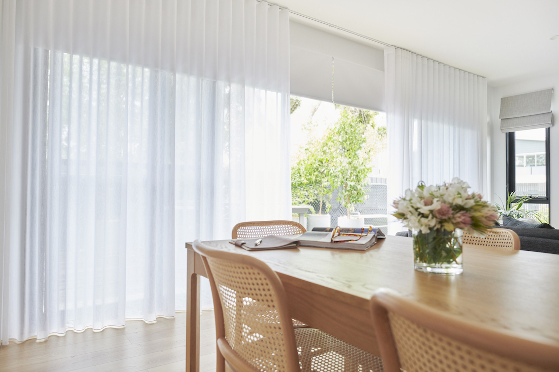 Sheer curtains over roller blind best window coverings to insulate your home