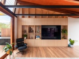 Living room cabinetry with Eames chair