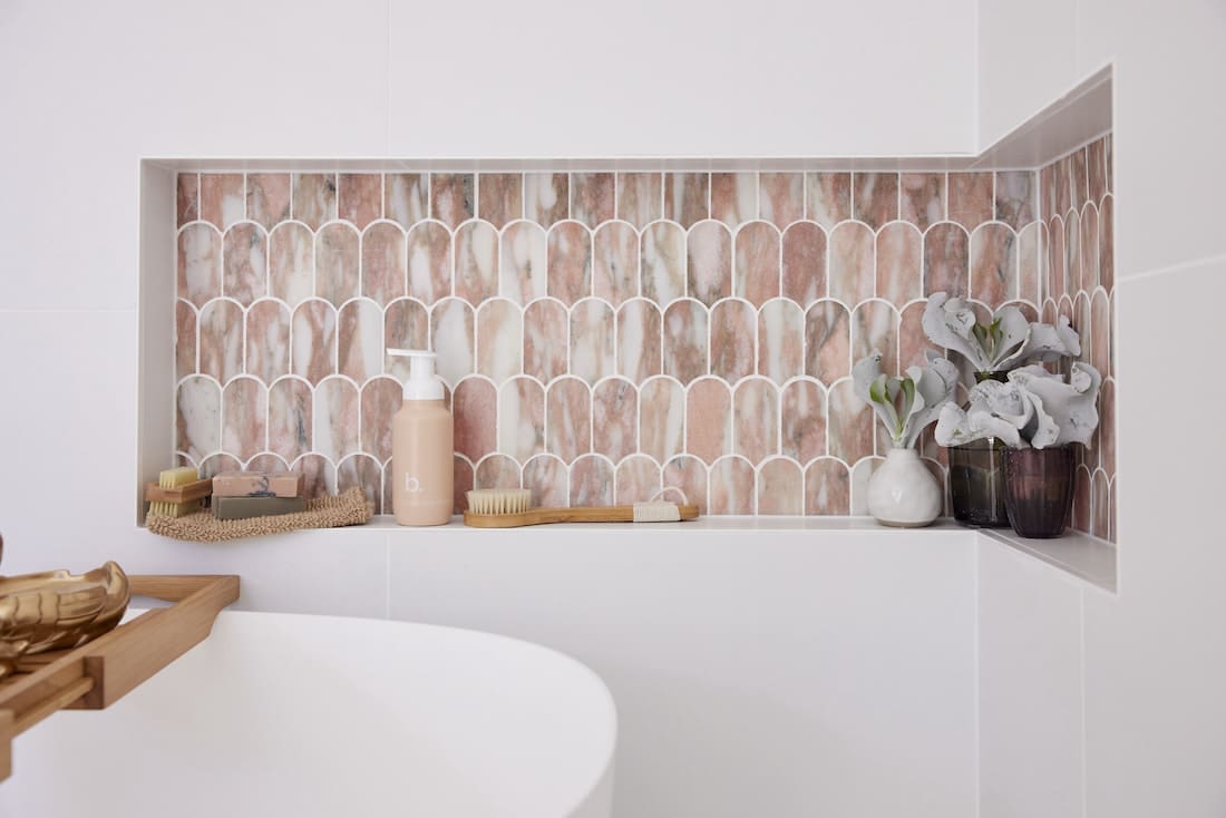 Shower niche with pink marble tiles