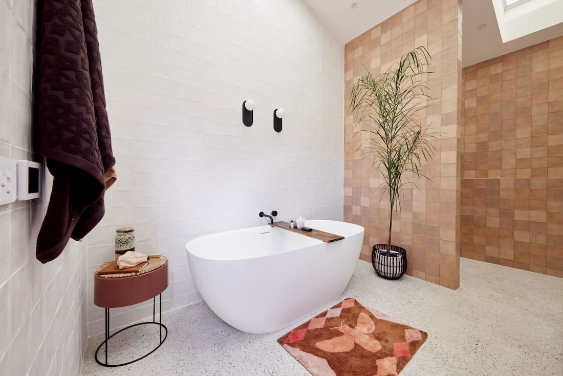 Freestanding bath with brown feature wall