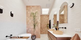 Moroccan feel bathroom with timber vanity and brown mosaic feature wall