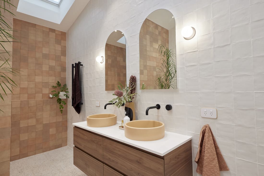 Double vanity with beige concrete sinks