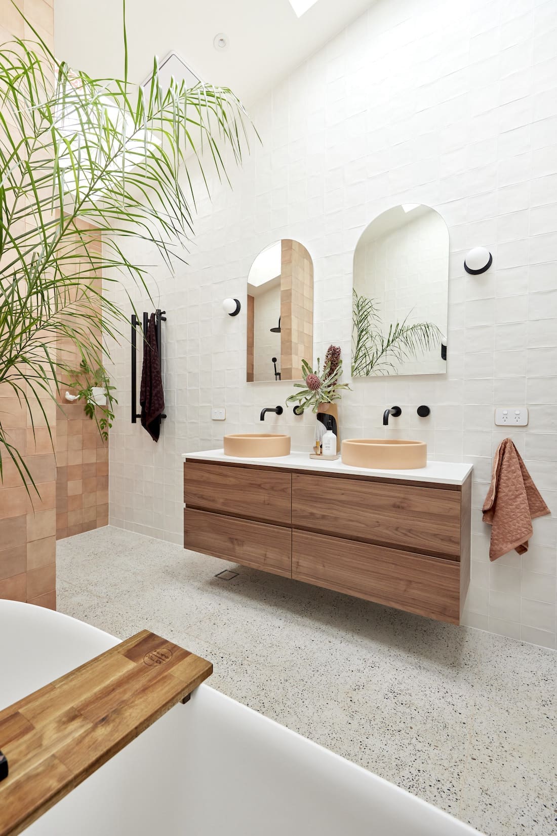 Timber floating vanity with arch mirrors