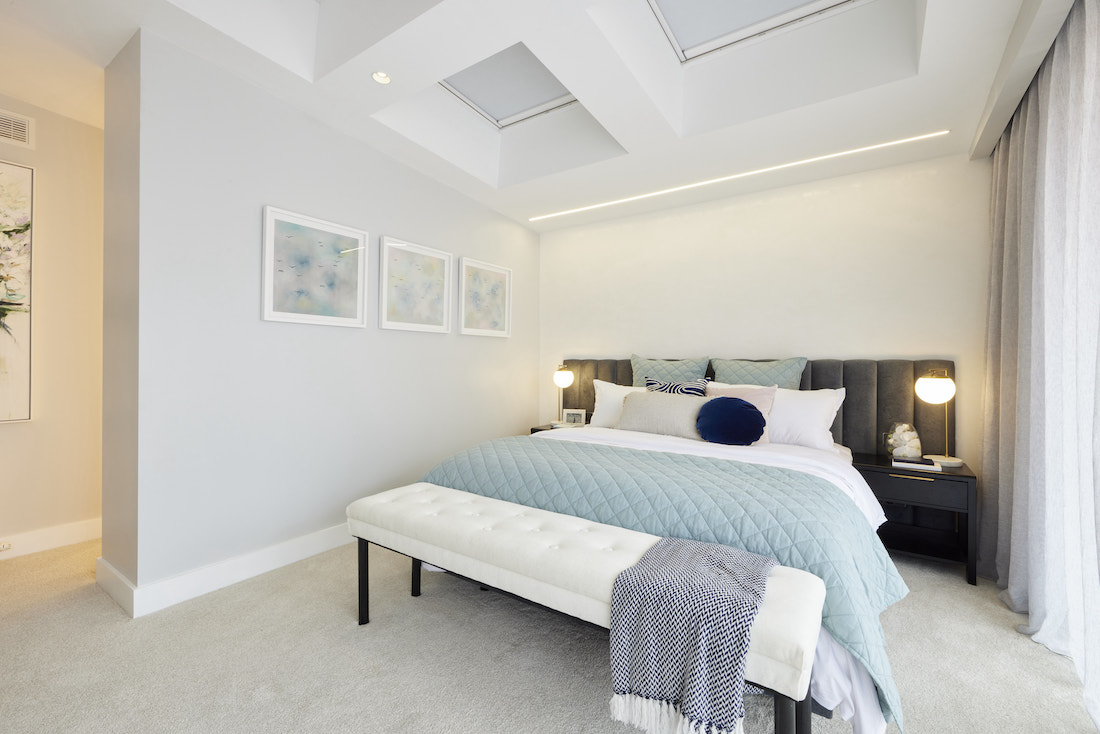 Master bedroom with architectural details on the ceiling