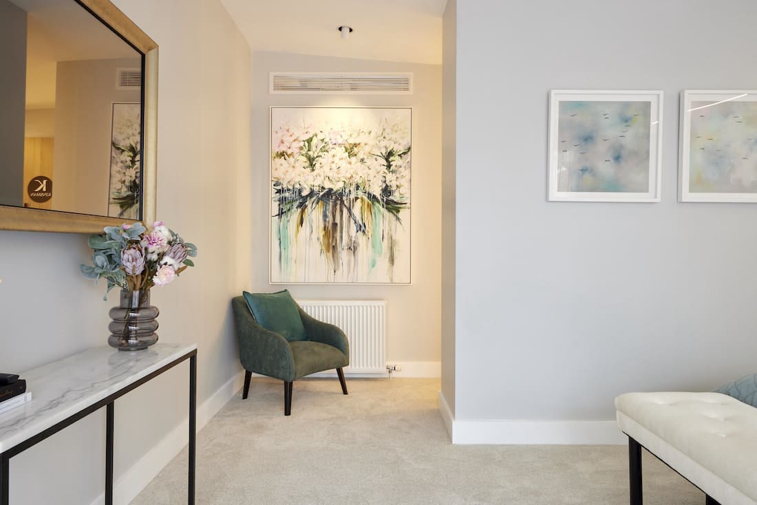 Entrance to walk in wardrobe with olive green chair