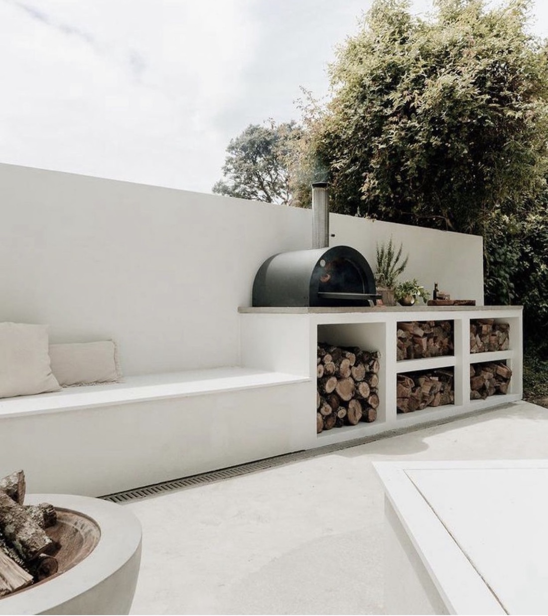 Outdoor kitchen with white concrete