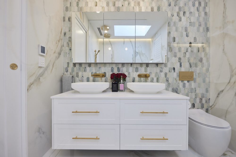 White vanity with green paddle pop tile