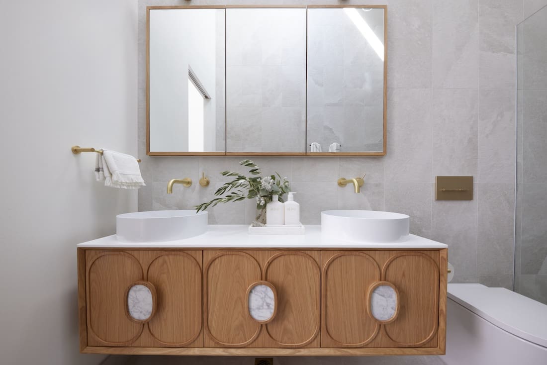 Petal panelled bathroom cabinet with marble insets