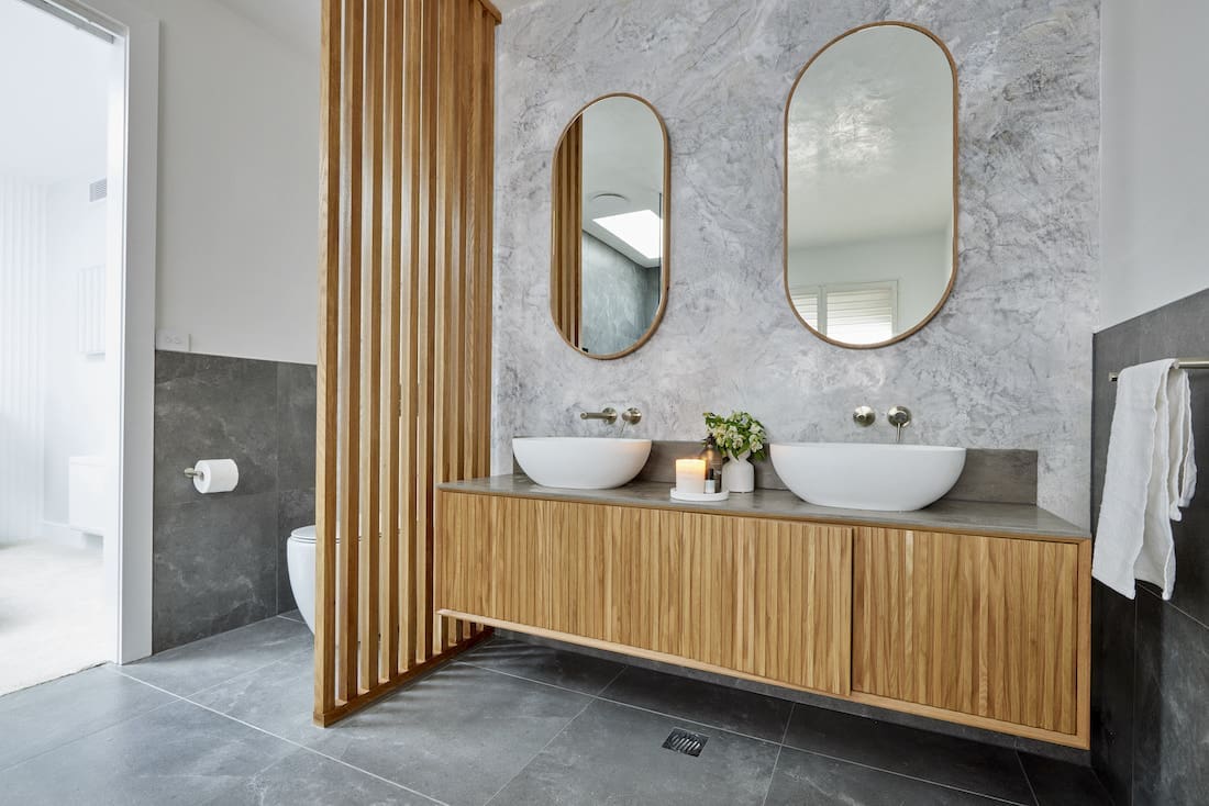 Timber panelled toilet wall in bathroom